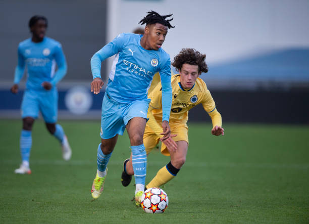 Micah Hamilton of Manchester City and Denzel De Roeve of Club Brugge KV in action during the UEFA Youth League match between Manchester City and Club...