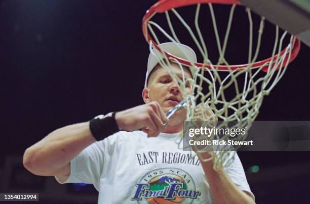 Bryant Reeves, Center for the Oklahoma State Cowboys cuts the net on the backboard hoop to celebrate winning the NCAA Division I Men's East Regional...