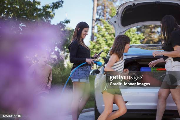 family packing car boot - car scandinavia stock pictures, royalty-free photos & images