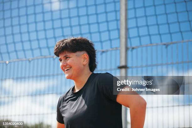 young woman at outdoor gym - androgynous stock pictures, royalty-free photos & images