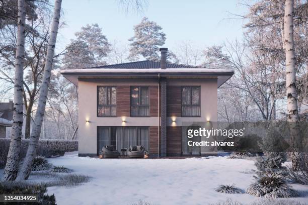 3d render of a bungalow surrounded by trees on a winter day - winter house stock pictures, royalty-free photos & images