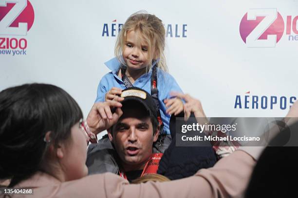 Kai Madison Trump sits on her father Donald Trump Jr.'s shoulders at Z100's Jingle Ball 2011, presented by Aeropostale Madison Square Garden on...
