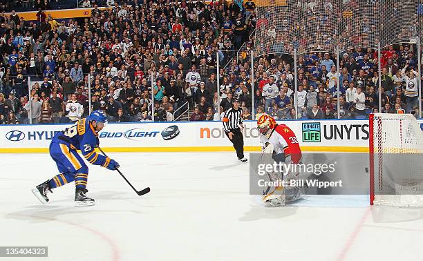 Jason Pominville of the Buffalo Sabres scores the game winning overtime goal against Scott Clemmensen of the Florida Panthers at First Niagara Center...