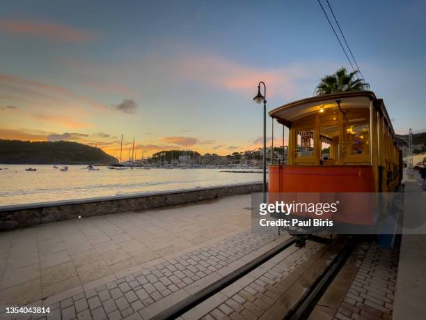the famous orange tram runs from soller to port de soller, mallorca, spain - palma majorca stock pictures, royalty-free photos & images