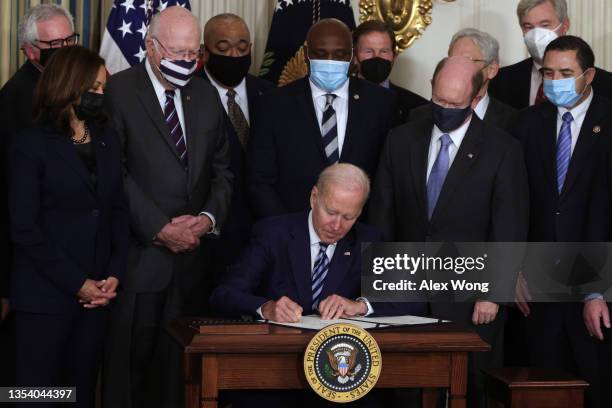 Flanked by lawmakers and members of his cabinet, U.S. President Joe Biden participates in a bill signing ceremony for S. 921, the “Jaime Zapata and...