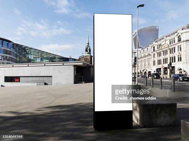 blank electronic screen on street in london financial district - london billboard stockfoto's en -beelden
