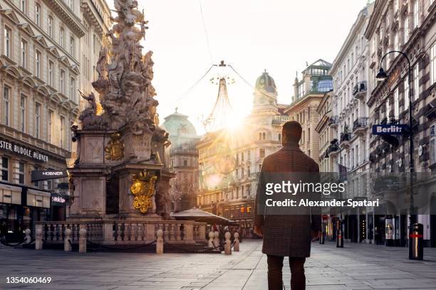 rear view of a man on the streets of vienna, austria - viena austria fotografías e imágenes de stock