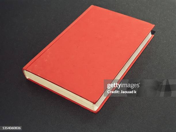 top view of a red book on table - book on table stock pictures, royalty-free photos & images