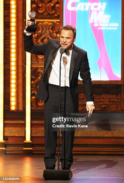 Winner of Best Performance by an Actor in a Leading Role in a Musical for 'Catch Me If You Can' Norbert Leo Butz speaks on stage during the 65th...