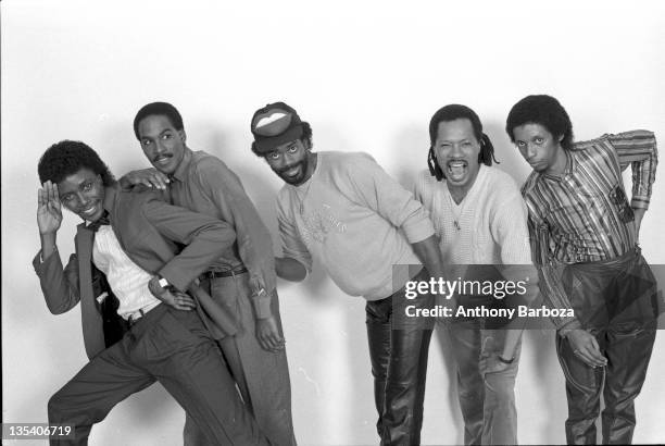 Portrait of the members of American rhyth & blues and funk band Cameo as they pose against a white background, 1982.