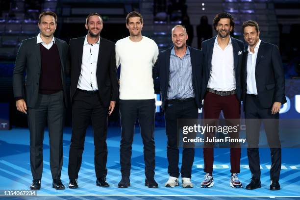 Former ATP players Ross Hutchins, Viktor Troicki, Martin Klizan, Steve Darcis, Julian Knowle and Paolo Lorenzi pose on court during Day Five of the...