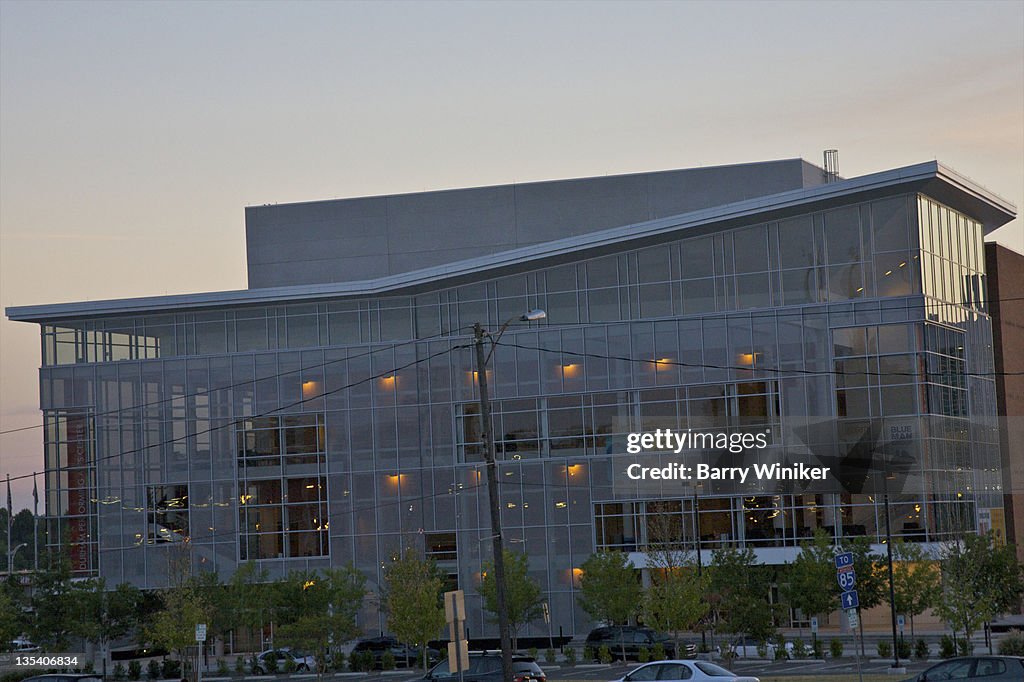 Contemporary glass-faced building at dusk.