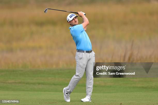 Austin Cook of the United States plays a shot on the 8th hole during the first round of The RSM Classic on the Seaside Course at Sea Island Resort on...