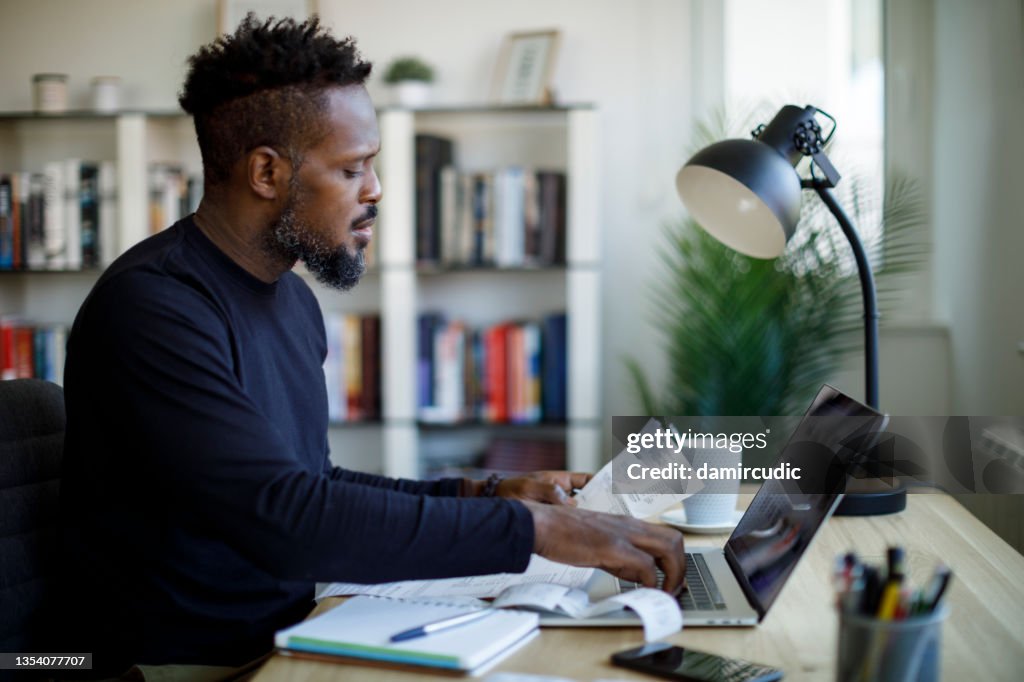 Man calculating budget and finances