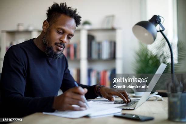 man working at home - business plan stock pictures, royalty-free photos & images