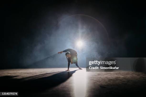 young ballerina rehearsing on the stage - audition stock pictures, royalty-free photos & images