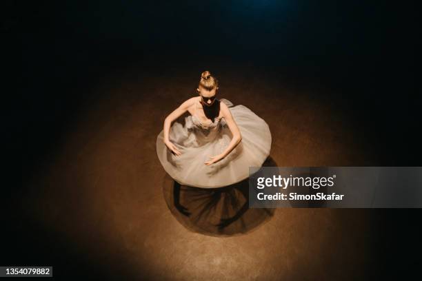 ballerina rehearsing on the stage - ballet stage stock pictures, royalty-free photos & images