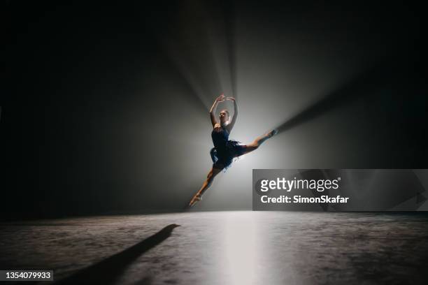 ballerina rehearsing on stage - stage performance space stock pictures, royalty-free photos & images