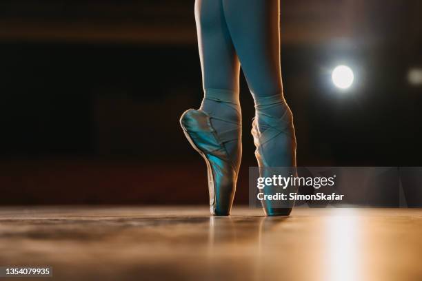 close up of ballerina en pointe on stage - dancing-bare stock pictures, royalty-free photos & images