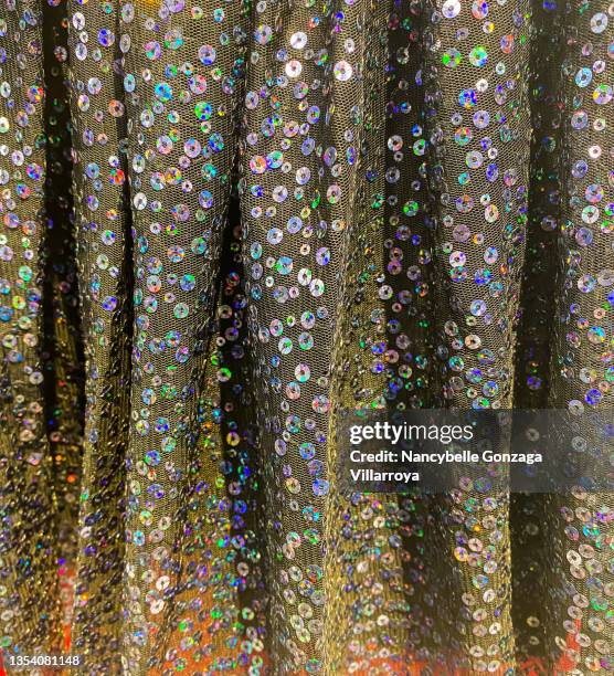 multi coloured sequins on a gray tulle fabric - sequin dress stock pictures, royalty-free photos & images