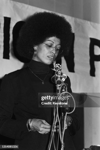 American political activist, Angela Davis, speaking at an anti-Apartheid rally at Friends House, Euston, London, 13th December 1974. Davis is in...