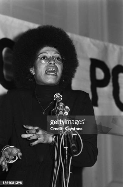 American political activist, Angela Davis, speaking at an anti-Apartheid rally at Friends House, Euston, London, 13th December 1974. Davis is in...