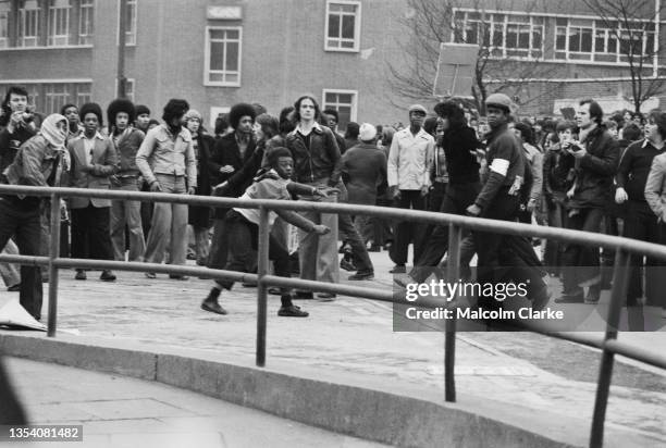 Demonstrators against the neo-fascist National Front party stone police during violent clashes outside Digbeth Civic Hall in Birmingham, where a...