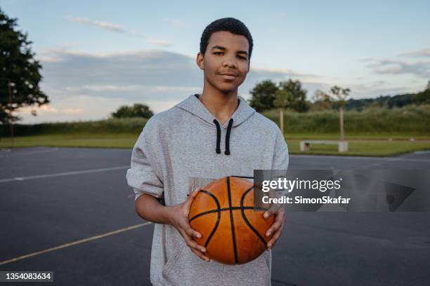 basketball player with ball - only teenage boys stock pictures, royalty-free photos & images