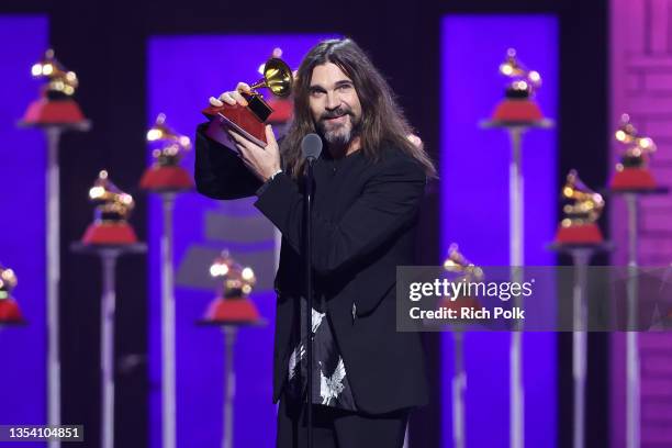 Juanes accepts Best Pop/Rock Album for "Origen" onstage at the Premiere Ceremony for The 22nd Annual Latin GRAMMY Awards at Michelob ULTRA Arena on...