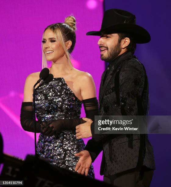 Kimberly Dos Ramos and Joss Favela speak onstage during The 22nd Annual Latin GRAMMY Awards at MGM Grand Garden Arena on November 18, 2021 in Las...