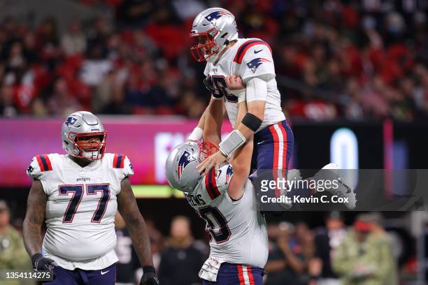 Mac Jones of the New England Patriots celebrates with David Andrews of the New England Patriots after a touchdown against the Atlanta Falcons in the...