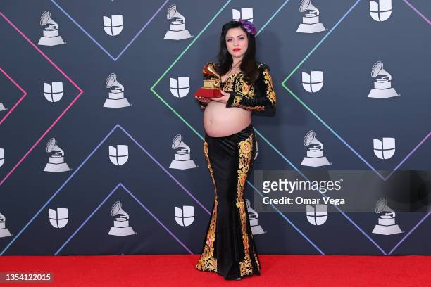 Chilean singer Mon Laferte poses with her Latin GRAMMY Award in the press room during the 22nd Annual Latin GRAMMY Awards at MGM Grand Garden Arena...