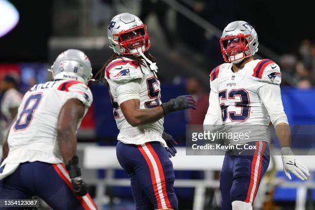 Kyle Van Noy of the New England Patriots and Dont'a Hightower of the New England Patriots react after a thrown interception by Matt Ryan of the...