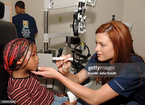 Danneel Harris performs an eye tracking test at eye examination station