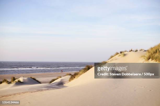 scenic view of beach against sky,koksijde,belgium - belgian coast stockfoto's en -beelden