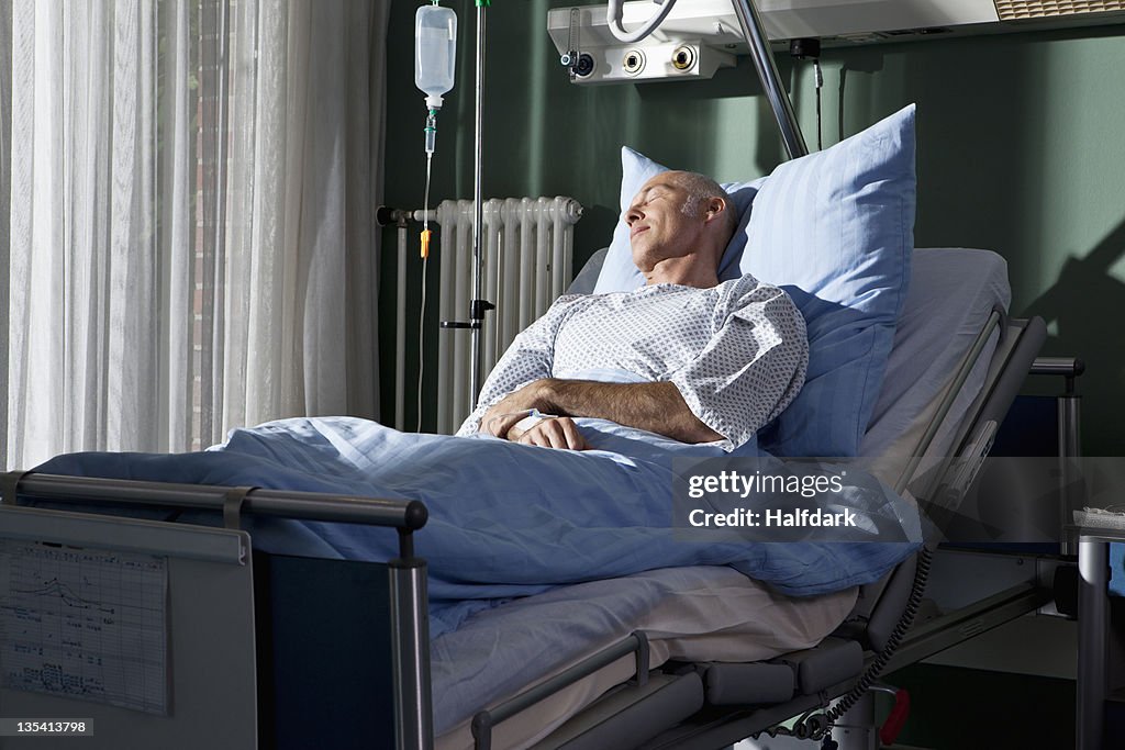 A man sleeping in a hospital bed