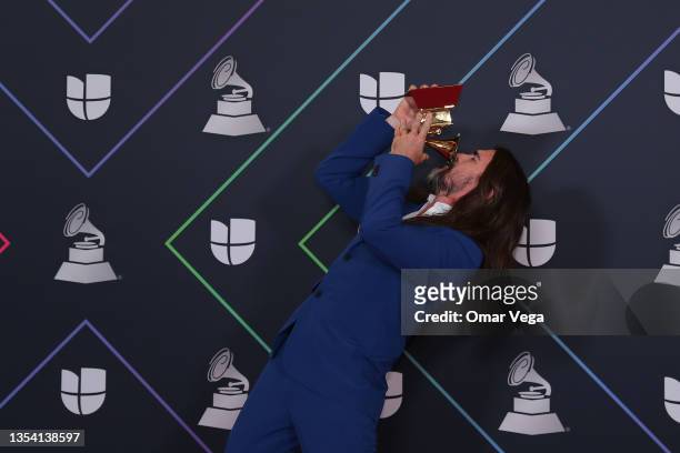 Colombian musician Juanes poses with his Latin GRAMMY Award in the press room during the 22nd Annual Latin GRAMMY Awards at MGM Grand Garden Arena on...