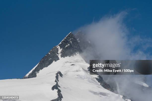 scenic view of snowcapped mountains against clear blue sky,austria - grossglockner fotografías e imágenes de stock