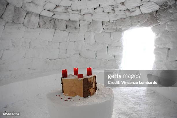 candles on table inside igloo. - igloo stock pictures, royalty-free photos & images