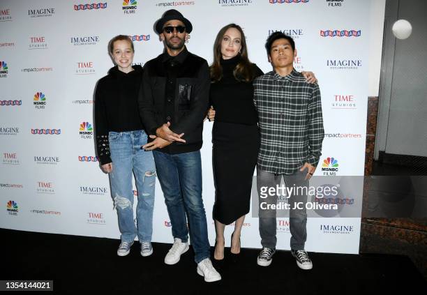 Shiloh Jolie-Pitt, street artist JR, actress Angelina Jolie and Pax Thien Jolie-Pitt attend the Los Angeles premiere of MSNBC Films' "Paper & Glue: A...