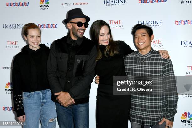 Shiloh Jolie-Pitt, street artist JR, actress Angelina Jolie and Pax Thien Jolie-Pitt attend the Los Angeles premiere of MSNBC Films' "Paper & Glue: A...