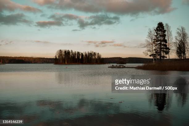 scenic view of lake against sky at sunset - darmell bildbanksfoton och bilder
