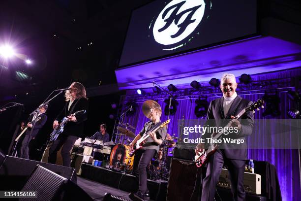 Chris Shiflett, Dave Grohl, Rami Jaffee, Nate Mendel and Pat Smear of the Foo Fighters perform onstage at the American Museum of Natural History Gala...