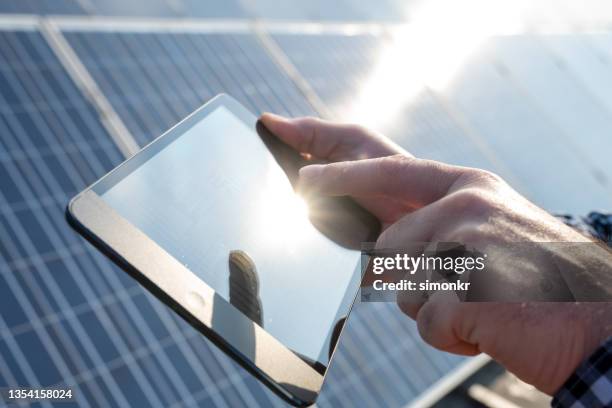 Tablet Using Solar Panel Solar Farm Tablet Photos and Premium High Res Pictures - Getty Images