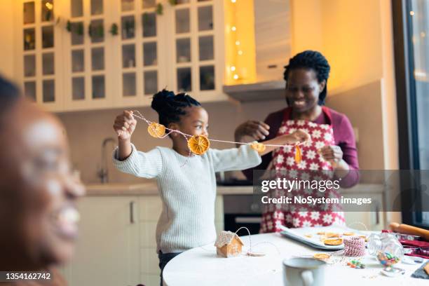 making sustainable christmas decoration - orange string stock pictures, royalty-free photos & images