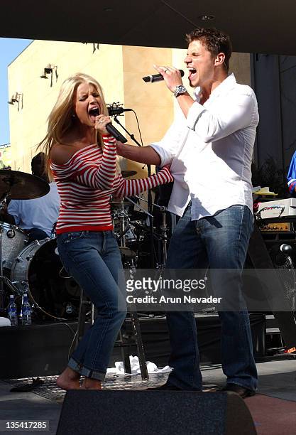 Jessica Simpson and Nick Lachey singing together during The USO Hosts "Salute the Troops" in Hollywood at Hollywood & Highland in Hollywood,...