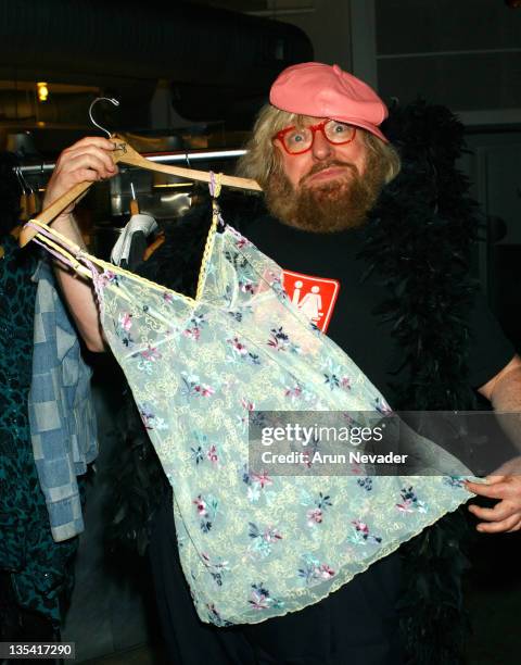 Bruce Vilanch wearing the leather cap belonging to Christine Aguilerra and holding the Anna Nicole Smith teddy