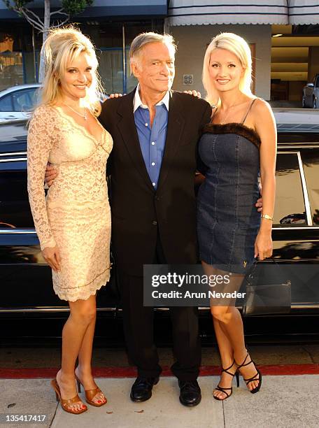 Hugh Hefner with Bridget and Holly during Christie's Exhibits Playboy at 50: Selections from the Archives at Christie's in Beverly Hills, California,...