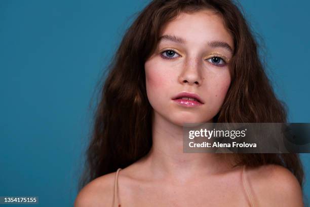 beautiful woman with make-up on blue background close-up foil in make-up - glamour girl stock pictures, royalty-free photos & images