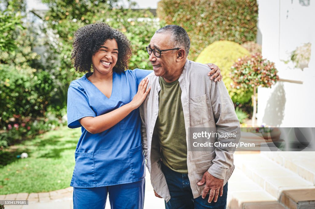 Shot of an attractive young nurse bonding with her senior patient outside